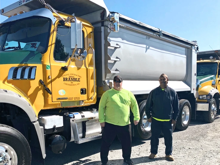 Employees in front of truck for unity ride